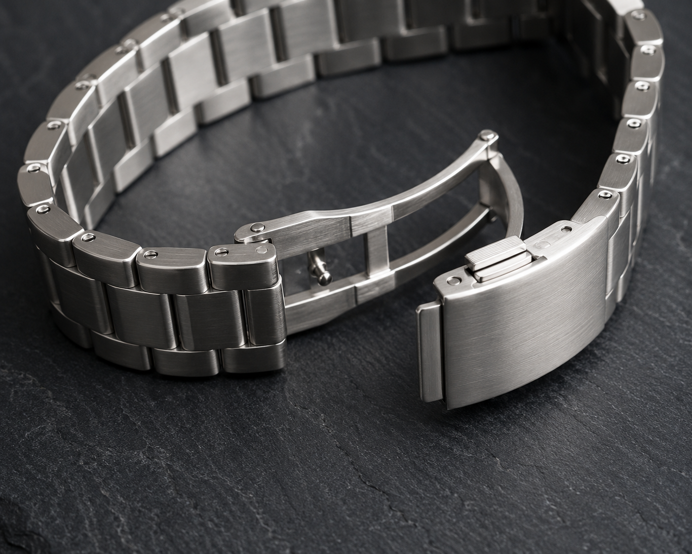 Close-up of stainless steel watch bracelet links and clasp for quality inspection