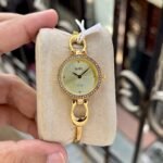 Coach Park Gold Tone Champagne Sunray Dial