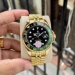 Rolex GMT-Master II Gold-Tone Green Dial - Image 2